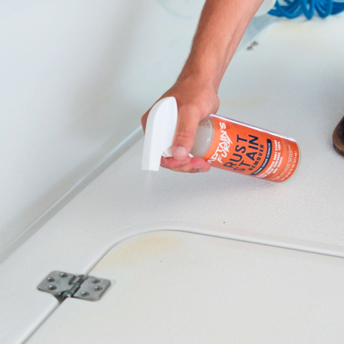 Spraying rust stain remover